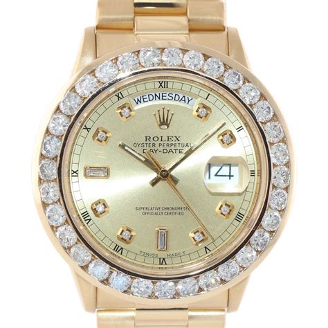 gold rolex with diamond bezel.